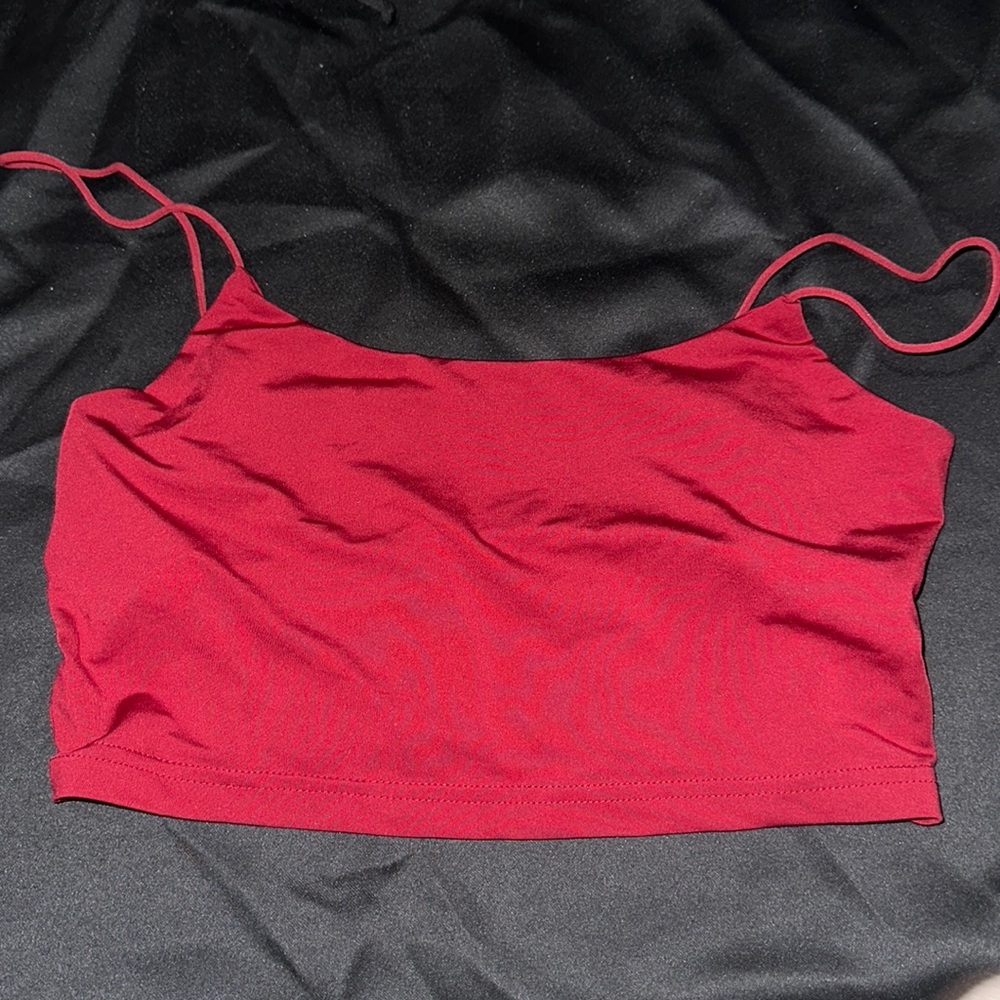 This is a size medium burgundy cropped tank top worn a couple of times .
